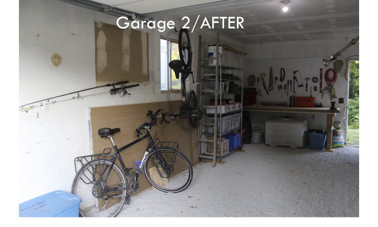 Organized garage with fresh gravel and tools accessible and labeled bins on shelves